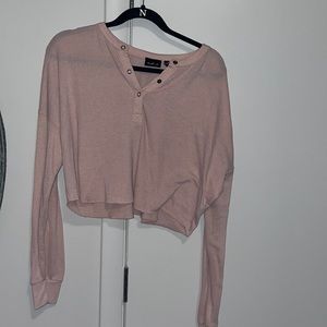 Pink knit long sleeve crop tee.
